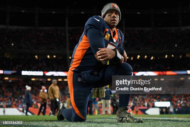Quarterback Russell Wilson of the Denver Broncos reacts after defeating the Minnesota Vikings in the NFL game at Empower Field At Mile High on...