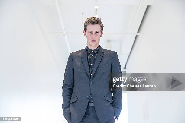 Actor Gabriel Mann poses backstage at the Philosophy by Natalie Ratabesi fashion show during Mercedes-Benz Fashion Week Spring 2014 at Roseland...