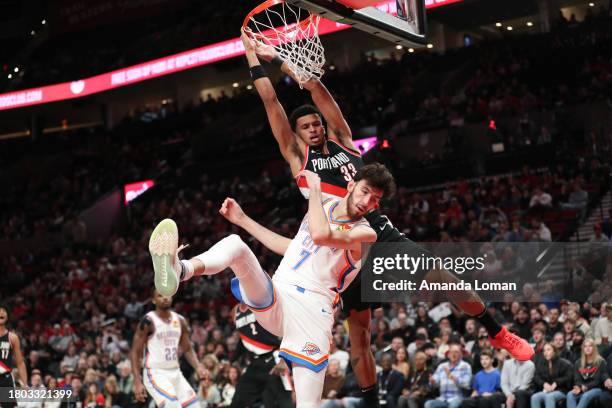 Toumani Camara of the Portland Trail Blazers dunks over Chet Holmgren of the Oklahoma City Thunder during the first quarter at Moda Center on...