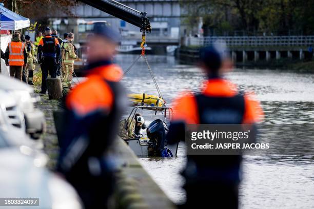 The body of Danny V.G. Is lifted out of the Dender river during a searching action in Aalst, Friday 24 November 2023. The remains belong to the...