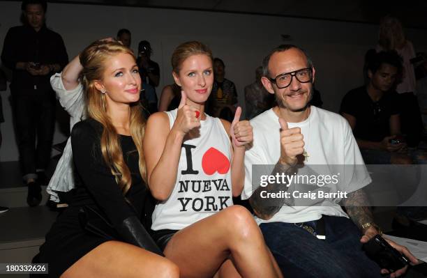 Paris Hilton, Nicky Hilton and Terry Richardson attend the Jeremy Scott fashion show during MADE Fashion Week Spring 2014 at Milk Studios on...