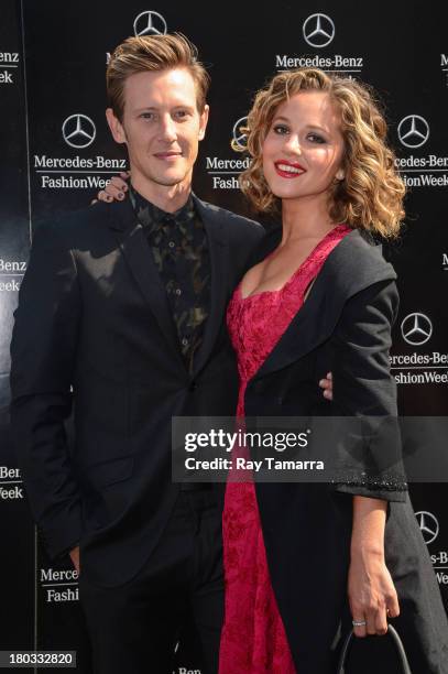 Actors Gabriel Mann and Margarita Levieva enter the Mercedes-Benz Fashion Week at Lincoln Center for the Performing Arts on September 11, 2013 in New...