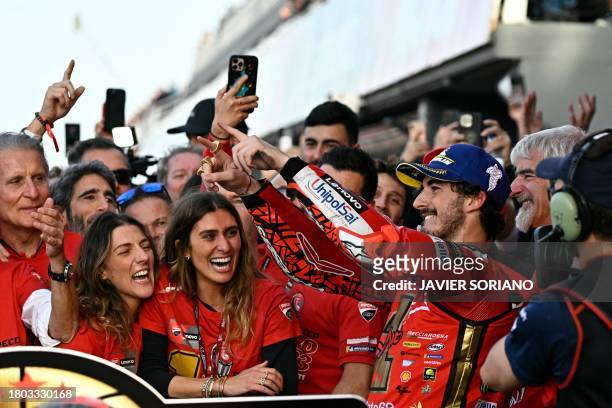 Ducati Italian rider Francesco Bagnaia celebrates winning the MotoGP Valencia Grand Prix at the Ricardo Tormo racetrack in Cheste, on November 26,...
