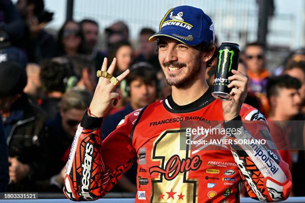Ducati Italian rider Francesco Bagnaia celebrates winning the MotoGP Valencia Grand Prix at the Ricardo Tormo racetrack in Cheste, on November 26,...