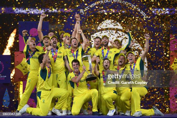 Australia captain Pat Cummins lifts the Cricket World Cup with teammates after winning the ICC Men's Cricket World Cup India 2023 Final between India...