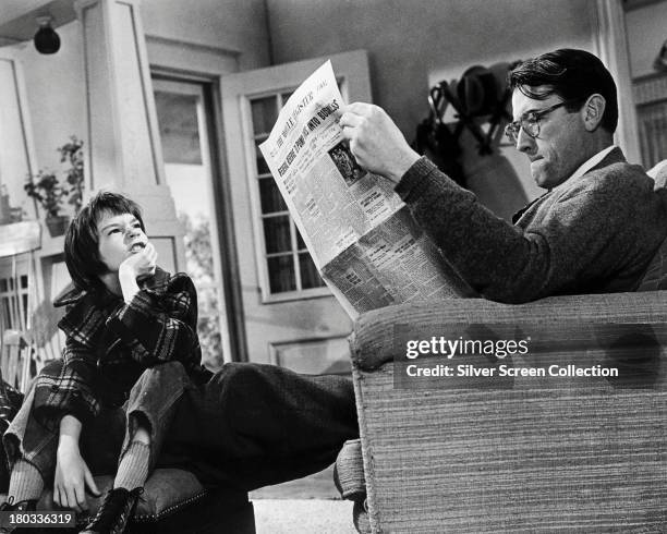 American actors Gregory Peck , as Atticus Finch, and Mary Badham as Scout, in 'To Kill A Mockingbird', directed by Robert Mulligan, 1962.