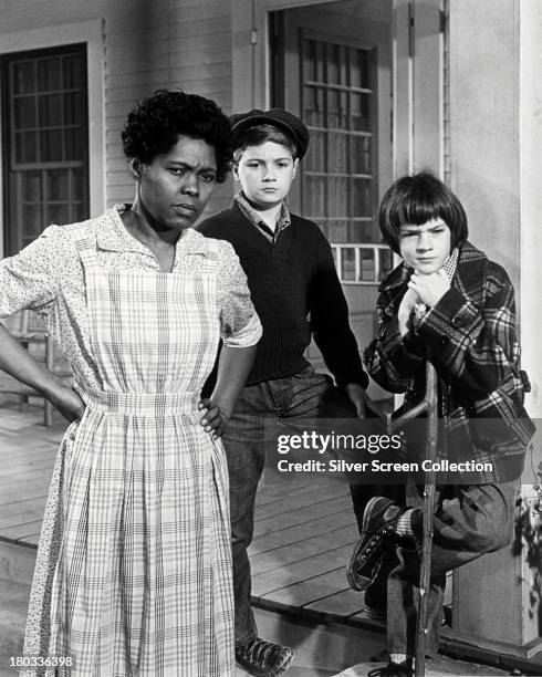 Estelle Evans as Calpurnia, Phillip Alford as Jem and Mary Badham as Scout, in 'To Kill A Mockingbird', directed by Robert Mulligan, 1962.