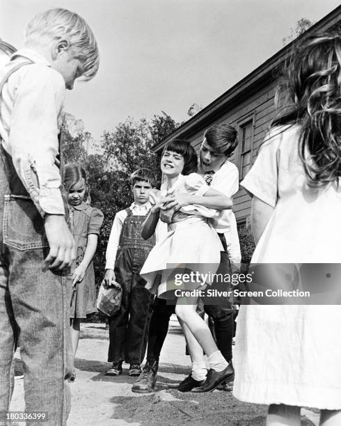 Struggle takes place between Jem and Scout Finch in a 'To Kill A Mockingbird', directed by Robert Mulligan, 1962.