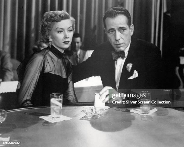 American actors Humphrey Bogart , as Dixon Steele, and Gloria Grahame 1923 - 1981) as Laurel Gray, in 'In A Lonely Place', directed by Nicholas Ray,...