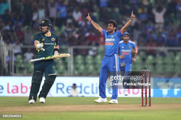 India's Ravi Bishnoi celebrates the wicket of Australia's Josh Inglis during game two of the T20 International Series between India and Australia at...