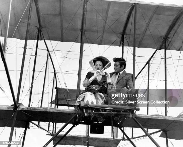 Patricia Rawnsley takes a flight with Orvil Newton in his 'Phoenix Flyer' in 'Those Magnificent Men In Their Flying Machines', directed by Ken...