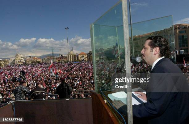 Saad Hariri, son of slain former Lebanese prime minister Rafiq Hariri, addresses supporters from behind a bullet proof glass during a mass gathering...
