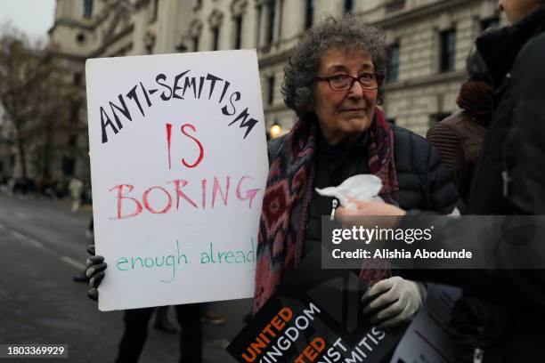 Protestor holds a a placard during a march against anti-Semitism on November 26, 2023 in London, England. The ongoing war between Israel and Hamas...