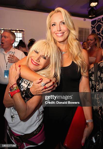 Designer Betsey Johnson and her daughter Lulu Johnson attend the Samsung Galaxy Blue Room at Mercedes-Benz Fashion Week Spring 2014 Collections at...