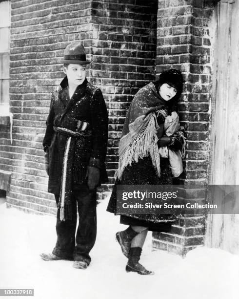 American comedian Harry Langdon with an unidentified actress in a promotional still for one of his silent comedy films, circa 1925.