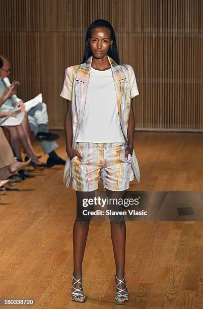 Model walks the runway at the Douglas Hannant fashion show during Mercedes-Benz Fashion Week Spring 2014 at the DiMenna Center on September 11, 2013...