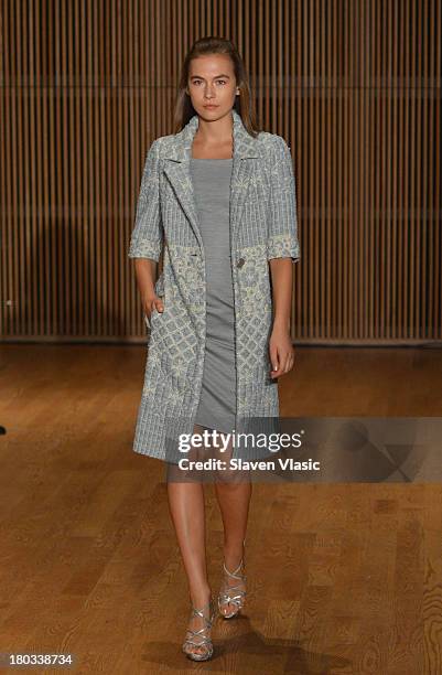 Model walks the runway at the Douglas Hannant fashion show during Mercedes-Benz Fashion Week Spring 2014 at the DiMenna Center on September 11, 2013...