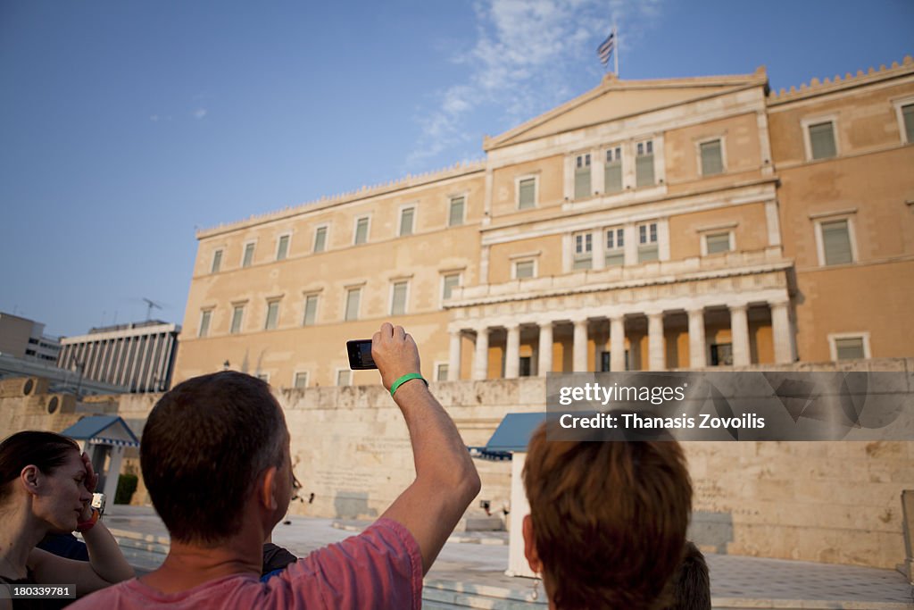 People gathered in front of the Greek Parliament