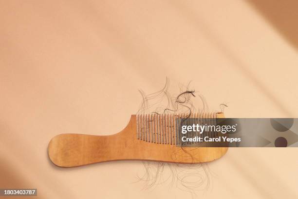 hair loss conceptual - comb hair care stock pictures, royalty-free photos & images