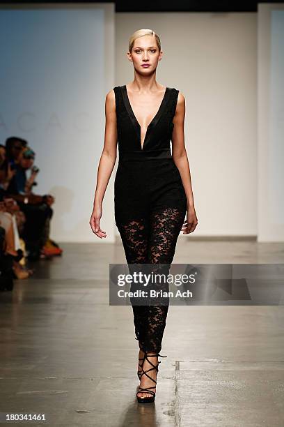 Model walks the runway at the Bela Criacao show during Nolcha Fashion Week New York Spring/Summer 2014 presented by RUSK at Pier 59 Studios on...