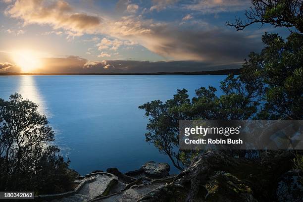 great place to watch a sunset, point chevalier - auckland light path stock pictures, royalty-free photos & images