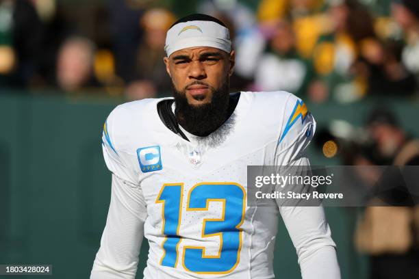 Keenan Allen of the Los Angeles Chargers participates in warmups prior to a game against the Green Bay Packers at Lambeau Field on November 19, 2023...