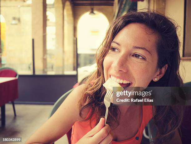 happy woman eating some fruit - reus spain fotografías e imágenes de stock