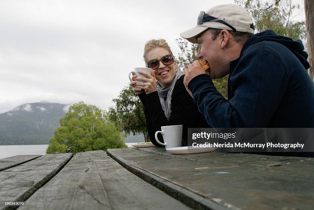 Couple enjoying lunch at water picnic