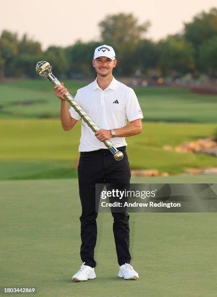 Nicolai Hojgaard of Denmark poses with the trophy after winning the DP World Tour Championship on the Earth Course at Jumeirah Golf Estates on...
