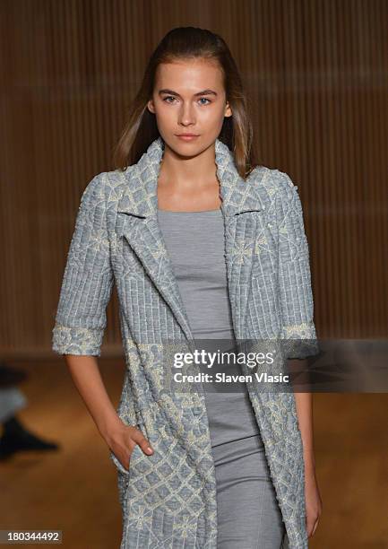 Model walks the runway at the Douglas Hannant fashion show during Mercedes-Benz Fashion Week Spring 2014 at the DiMenna Center on September 11, 2013...