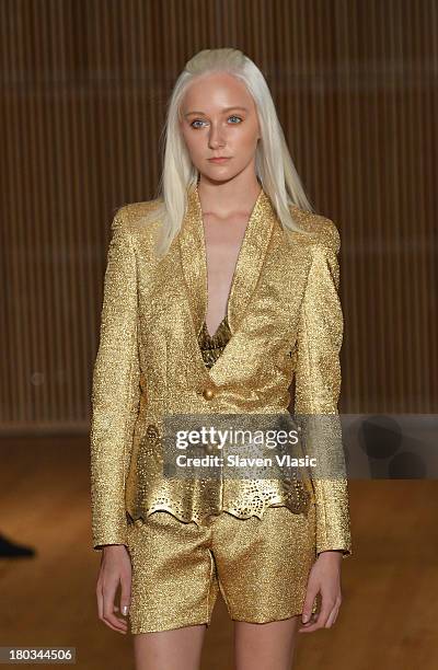 Model walks the runway at the Douglas Hannant fashion show during Mercedes-Benz Fashion Week Spring 2014 at the DiMenna Center on September 11, 2013...
