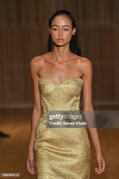 Model walks the runway at the Douglas Hannant fashion show during Mercedes-Benz Fashion Week Spring 2014 at the DiMenna Center on September 11, 2013...