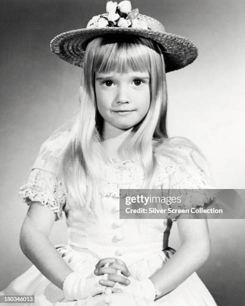 American child actress Kim Richards wearing a sun hat, circa 1970.