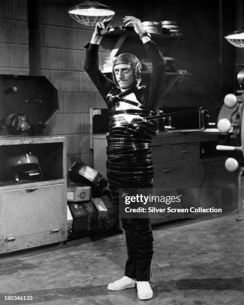 Marty Eggs, played by English actor and comedian Marty Feldman , wrapped in film stock in an editing room scene in 'Silent Movie', directed by Mel...