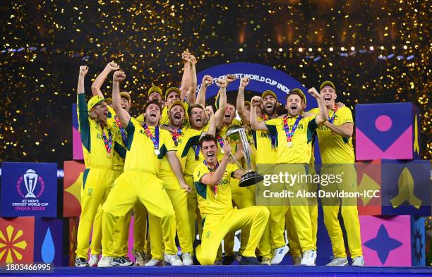 Pat Cummins of Australia lifts the ICC Mens Cricket World Cup 2023 Trophy after victory in the ICC Men's Cricket World Cup India 2023 Final between...