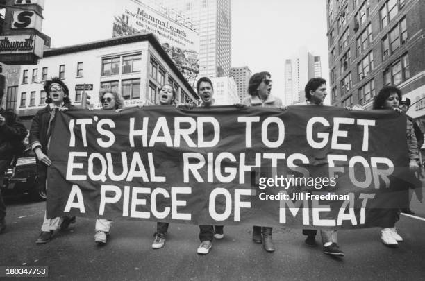 Women march holding a banner reading 'It's Hard To Get Equal Rights For A Piece Of Meat' during a demonstration for sexual equality, New York City,...