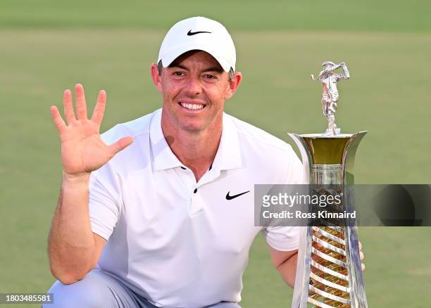 Rory McIlroy of Northern Ireland poses with the Race to Dubai trophy on the 18th green during Day Four of the DP World Tour Championship on the Earth...