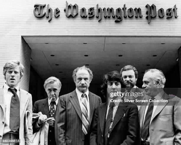 The director and cast members of 'All The President's Men' outside the offices of the Washington Post, 1976. Left to right: Robert Redford , Jason...