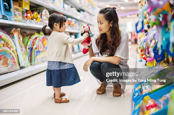 young mom & toddler playing with puppet doll toy - chinese dolls stock pictures, royalty-free photos & images
