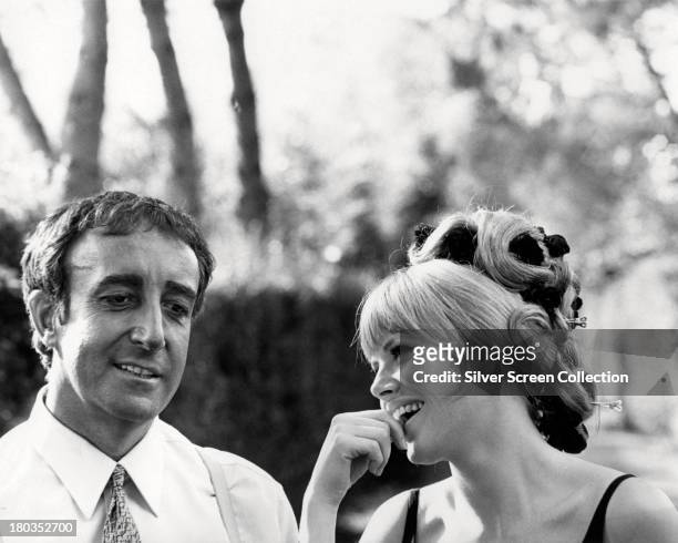 British comic actor Peter Sellers with his wife, Swedish actress Britt Ekland, on the set of 'The Bobo', directed by Robert Parrish, 1967.