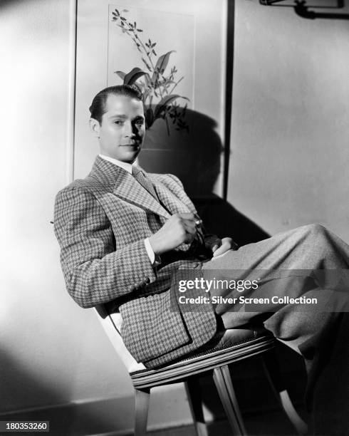 American actor Franchot Tone , wearing a tweed jacket, circa 1935.