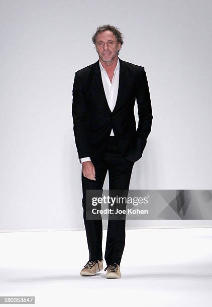 Designer Oskar Metsavaht walks the runway at the Osklen fashion show during Mercedes-Benz Fashion Week Spring 2014 at The Stage at Lincoln Center on...