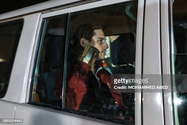 An International Red Cross vehicle carrying Israeli Russian hostage Ron Krivoy released by Hamas drives towards the Rafah border point with Egypt...