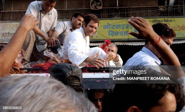 Rahul Gandhi, son of President of the Congress Party and Chairperson of the United Progressive Alliance Government Sonia Gandhi extends his hand...