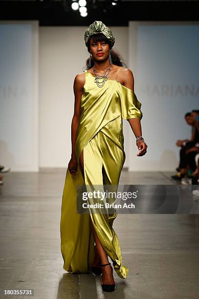 Model walks the runway at the Mariana Valentina show during Nolcha Fashion Week New York Spring/Summer 2014 presented by RUSK at Pier 59 Studios on...