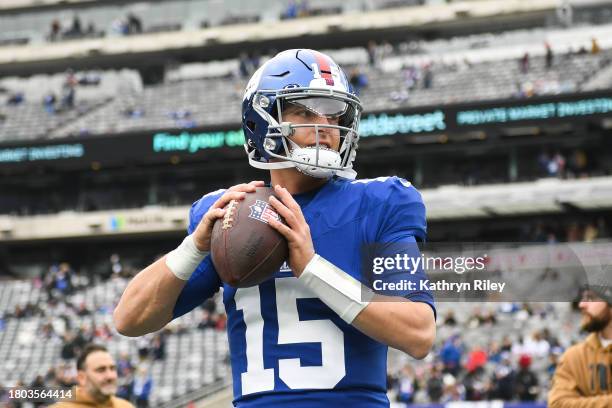 Tommy DeVito of the New York Giants throws the football prior to the start of the game against the New England Patriots at MetLife Stadium on...