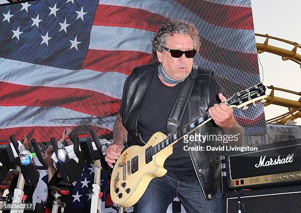 Sex Pistols guitarist Steve Jones performs at Cycle For Heroes: A Rock Inspired Ride at Santa Monica Pier on September 11, 2013 in Santa Monica,...