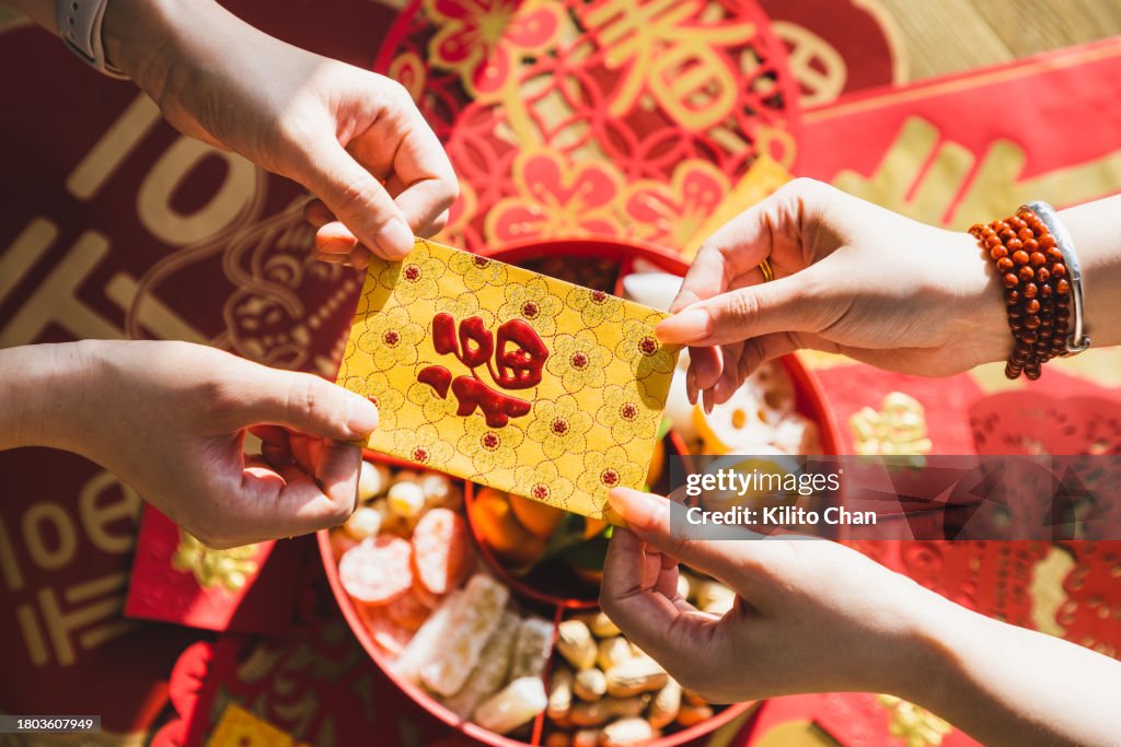 Giving and receiving Chinese new year red envelop