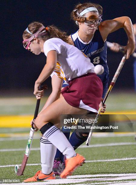 Oakton's Sydney Applegate, left, and Katie Cummings collide during the South County Stallions defeat of the Oakton Cougars 2 - 1 in girls field...