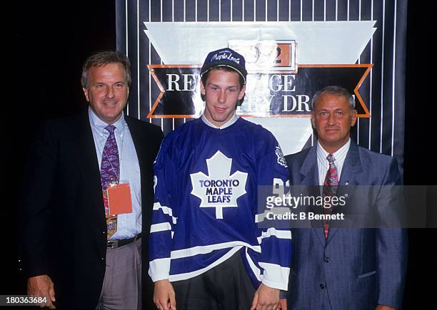 Grant Marshall the 23rd overall pick of the 1992 NHL Draft poses for a portrait on the stage after being selected by the Toronto Maple Leafs on June...